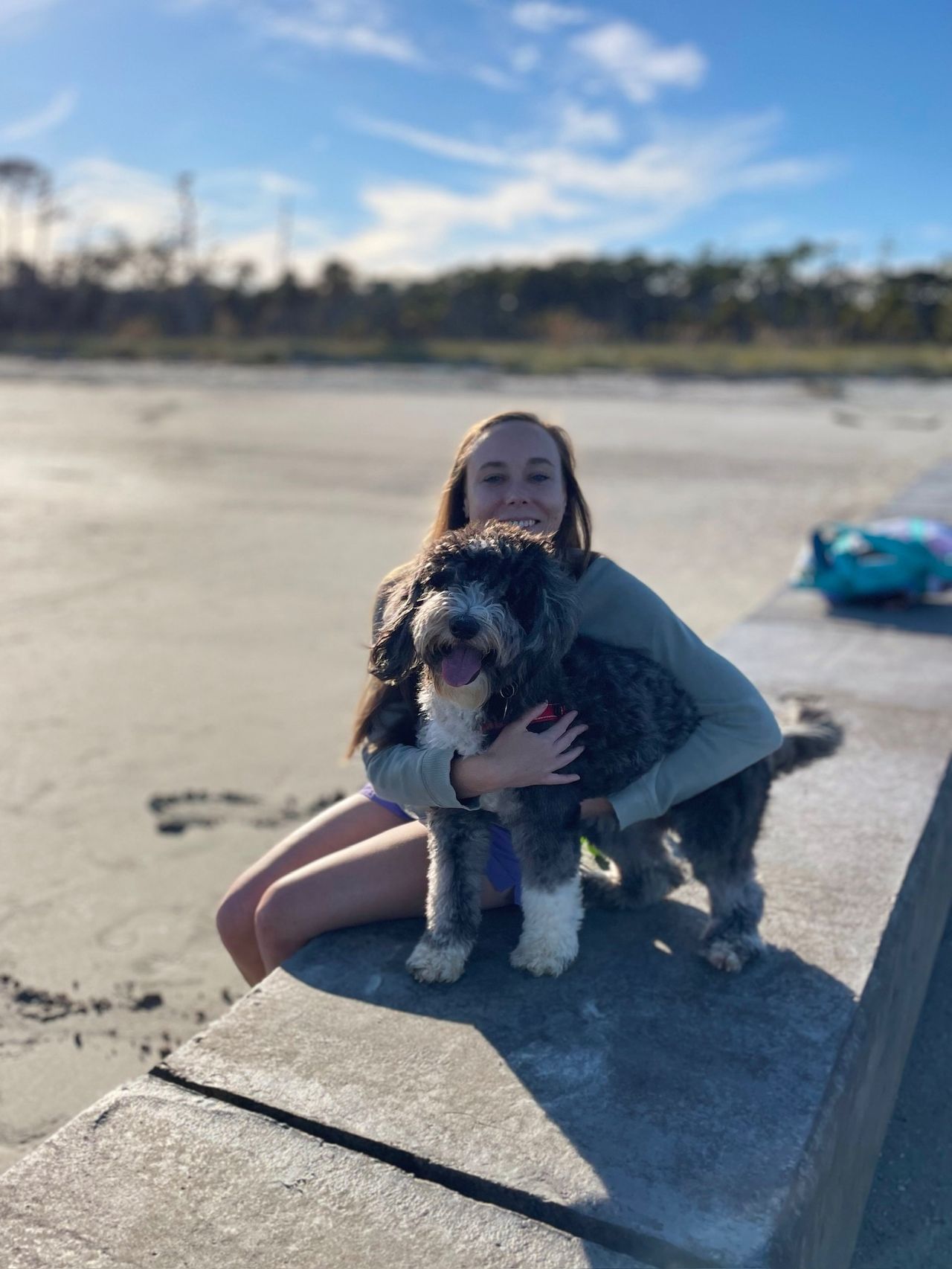 Holly hugs Otto on a wall at Hunting Island
