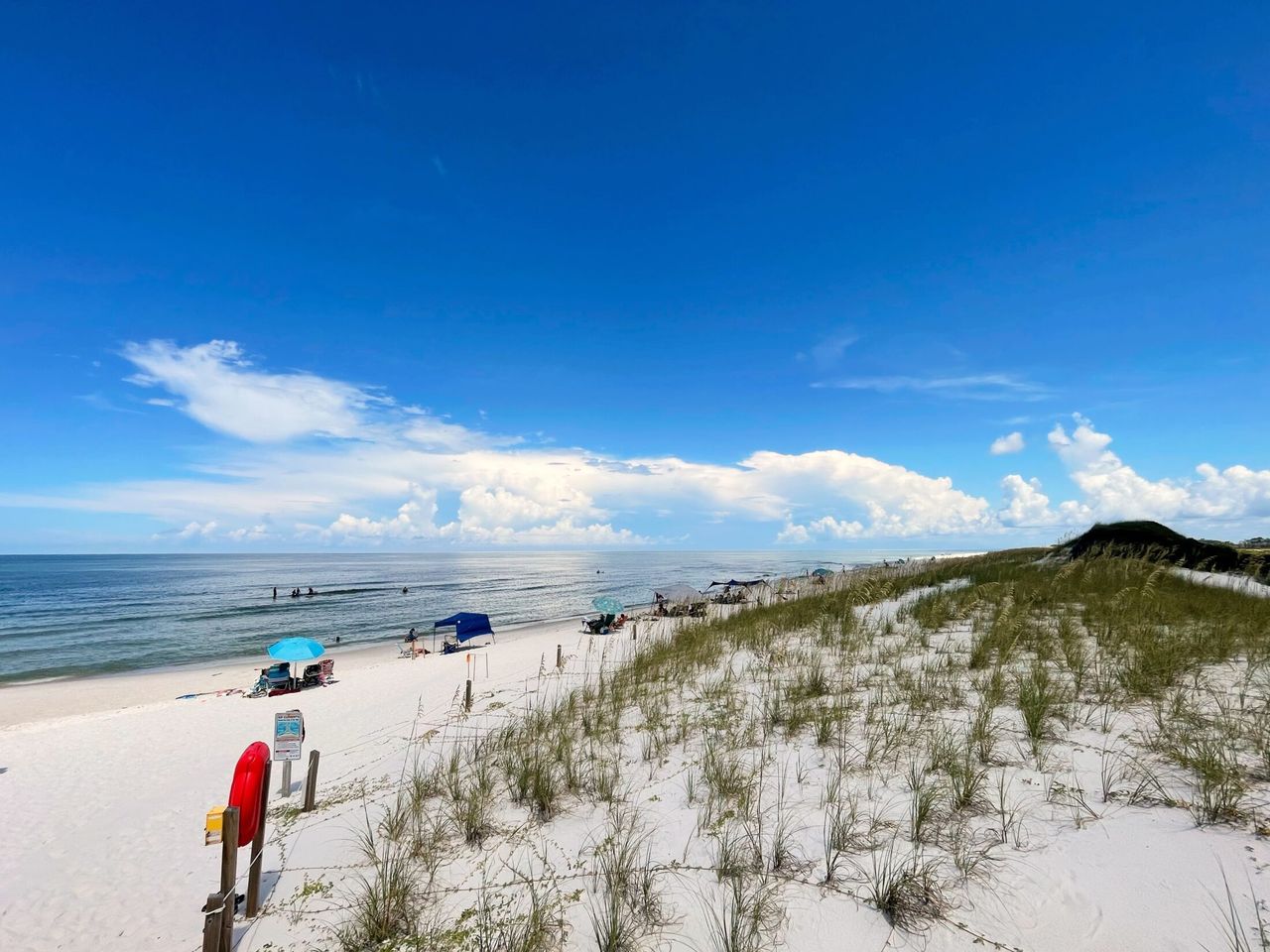 Beach dunes to the right of the entrance.