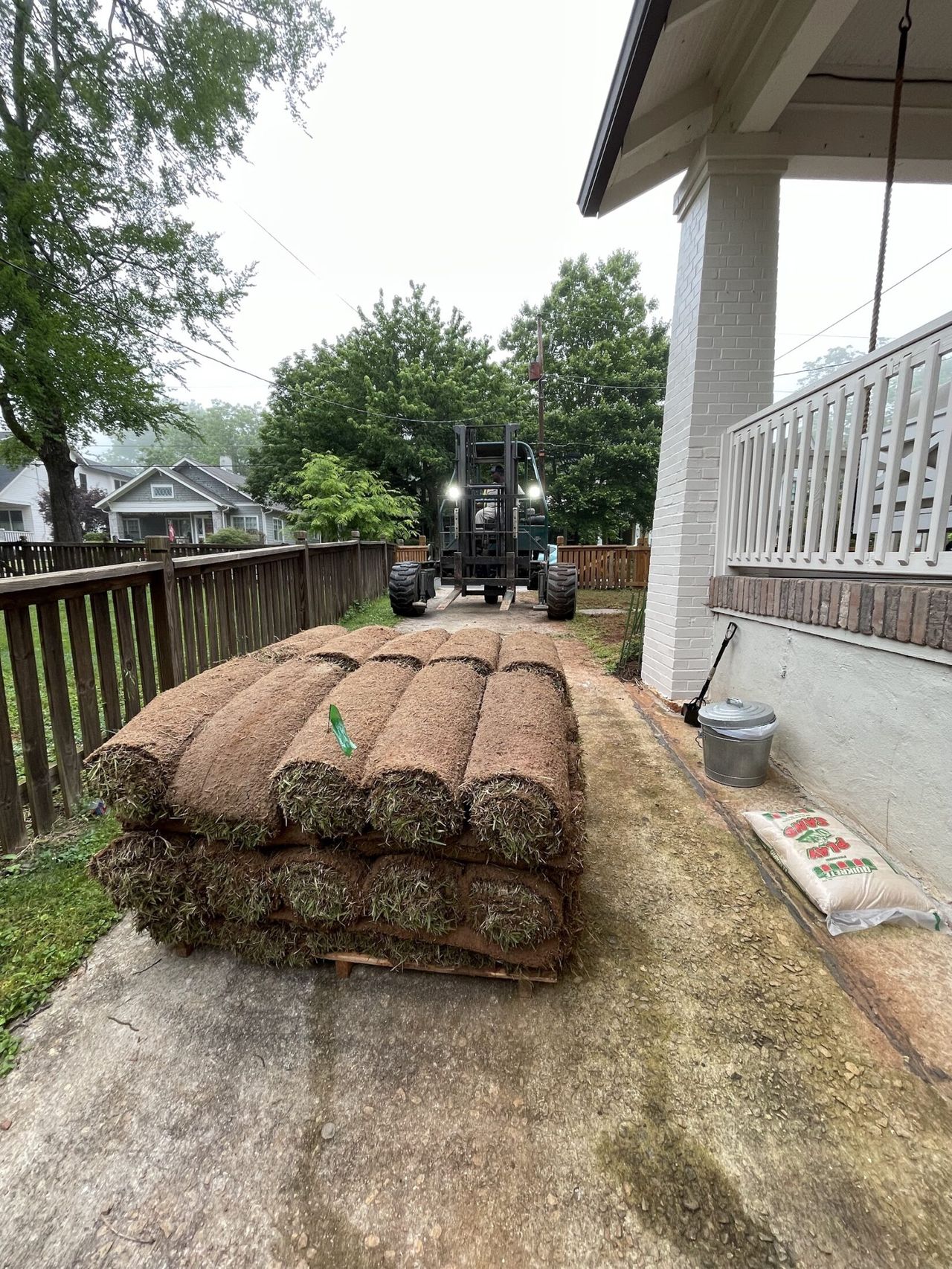 Forklift dropping of sod in my driveway