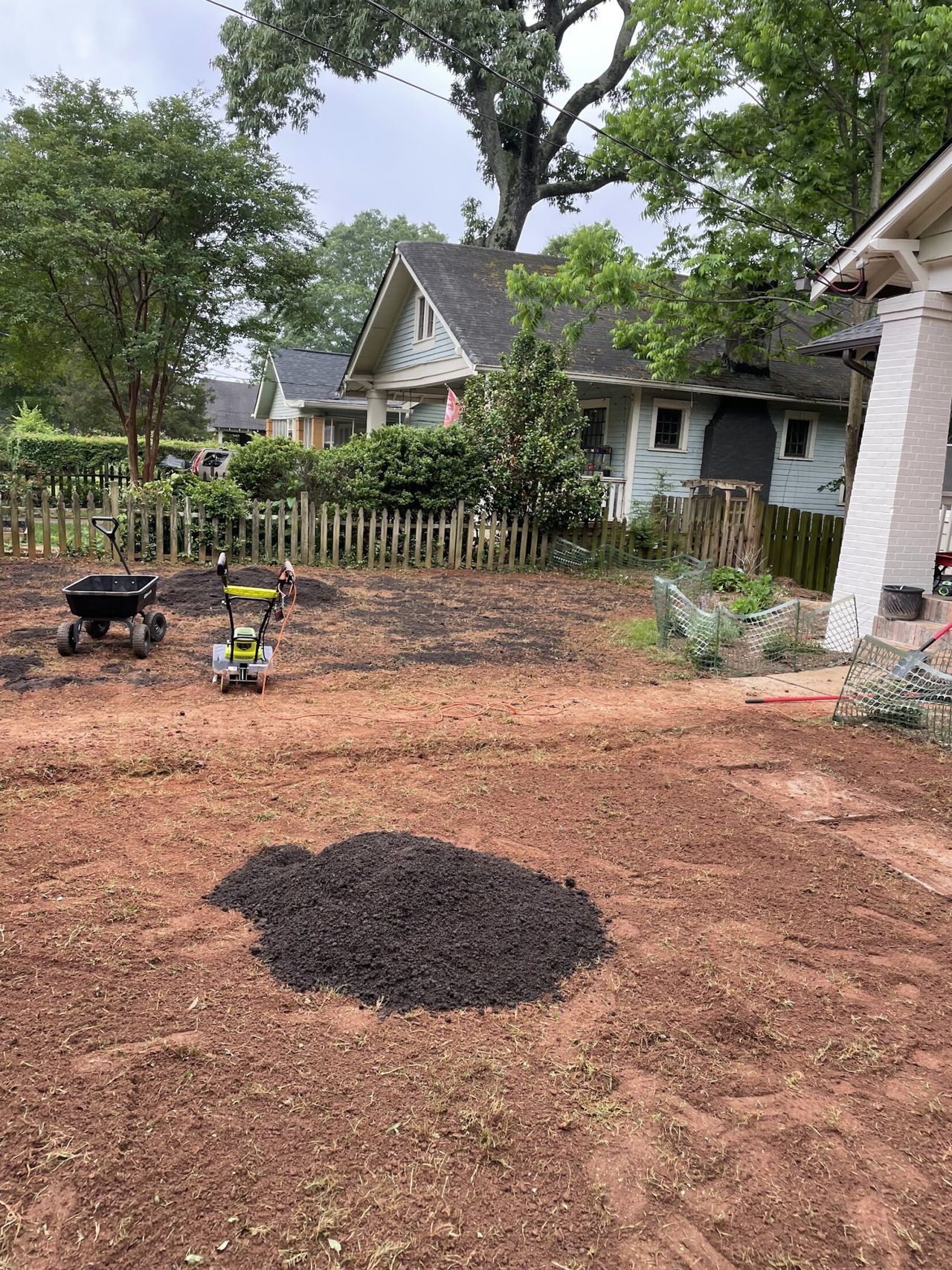 Spreading out the bag of compost