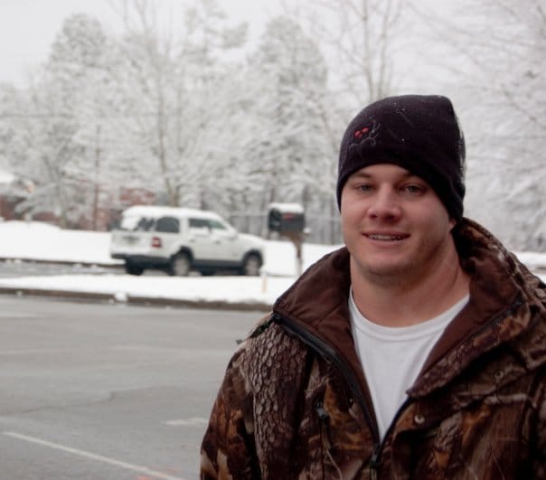 Mackey poses in the parking lot.