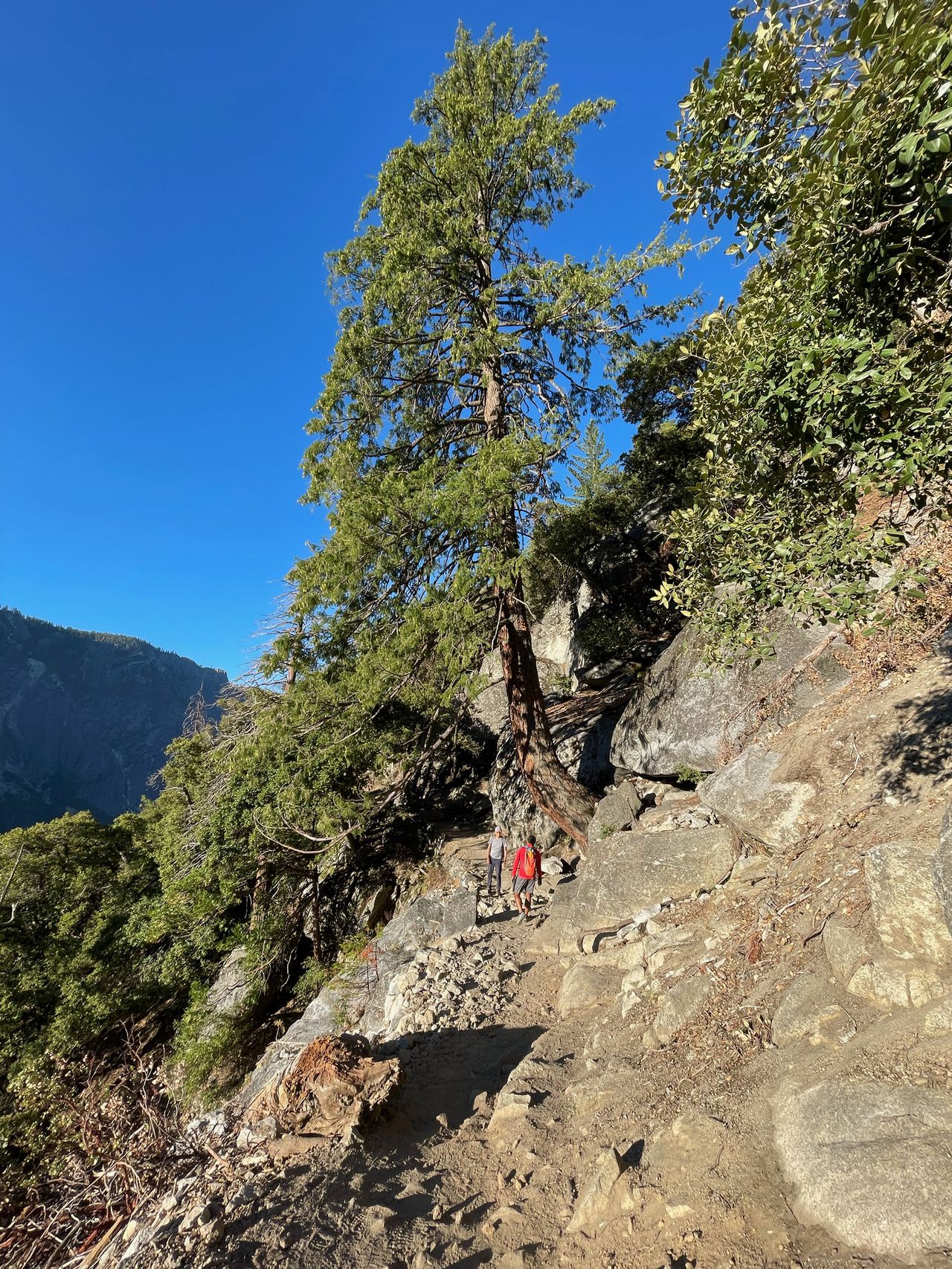 Andi talking to an older man on the trail.