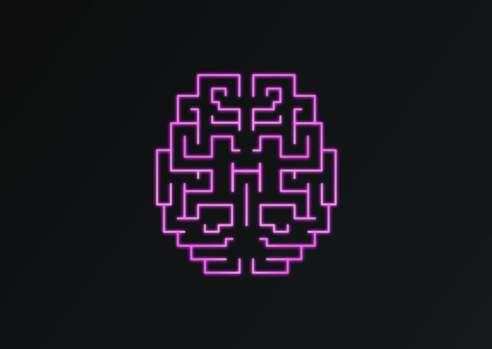 Glowing pink neon outline of a brain drawn as a maze on a black background