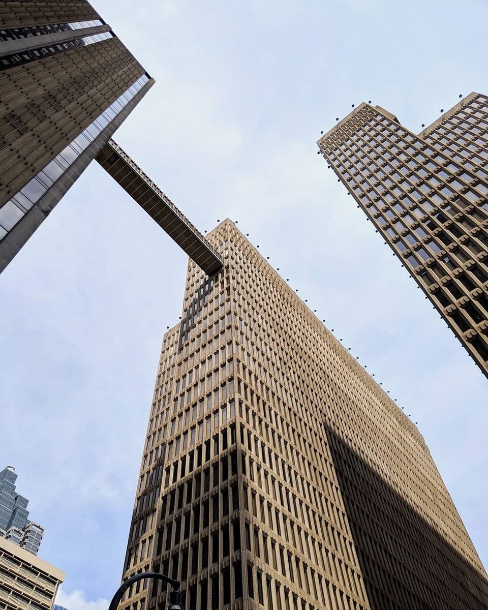 Low angle of downtown Atlanta towers with a skybridge connecting two of them