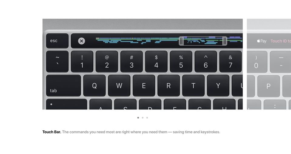 MacBook Pro keyboard close-up showing a physical esc key beside the Touch Bar