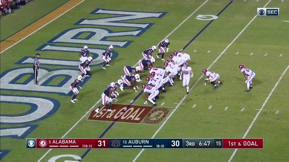 Alabama lined up at first and goal against Auburn, with the score Alabama 31, Auburn 30 in the third quarter