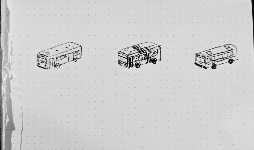 Three ink sketches of buses in isometric perspective on dotted notebook paper