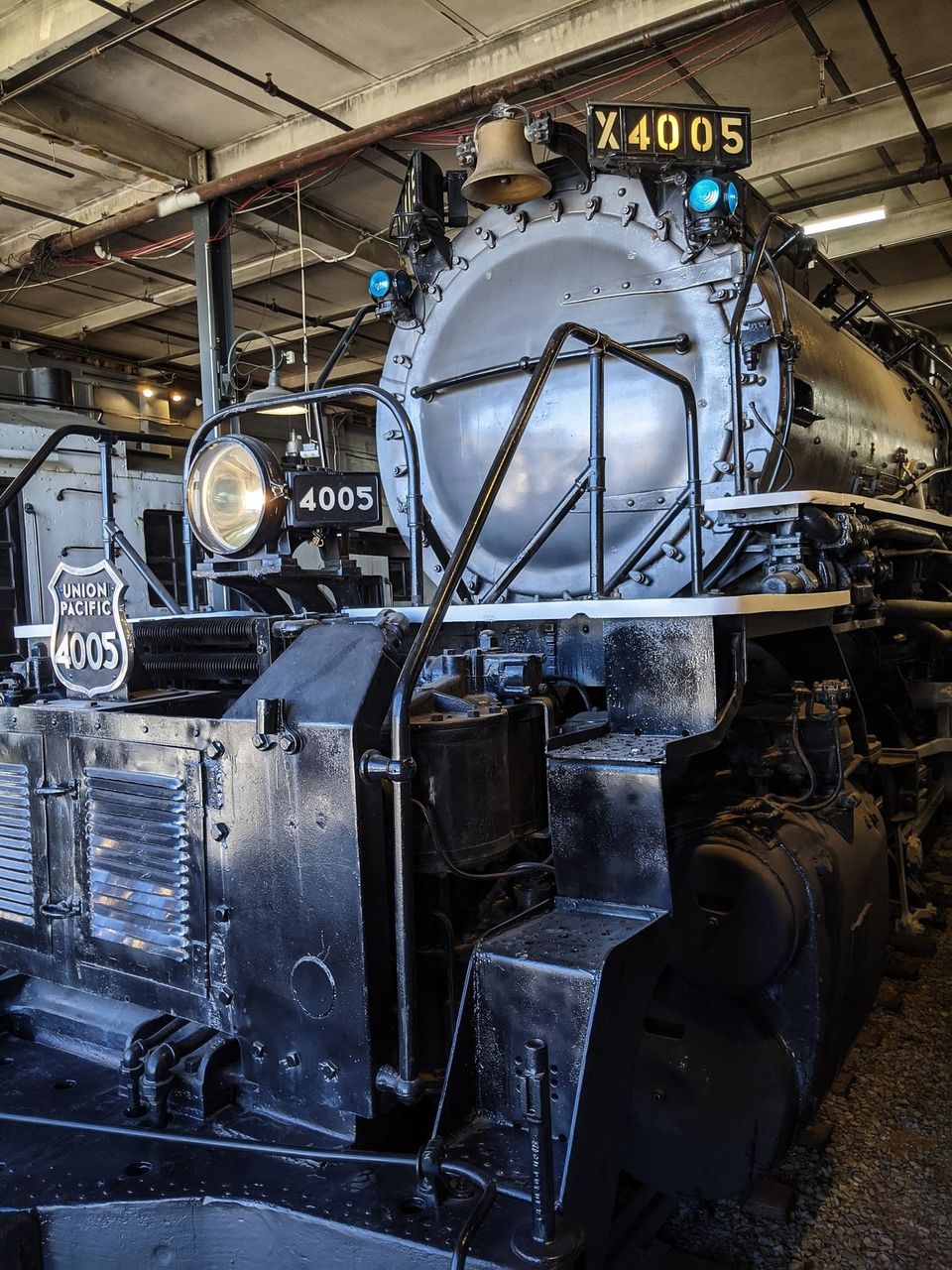 Front of Union Pacific Big Boy steam locomotive number 4005 with a brass bell and headlight