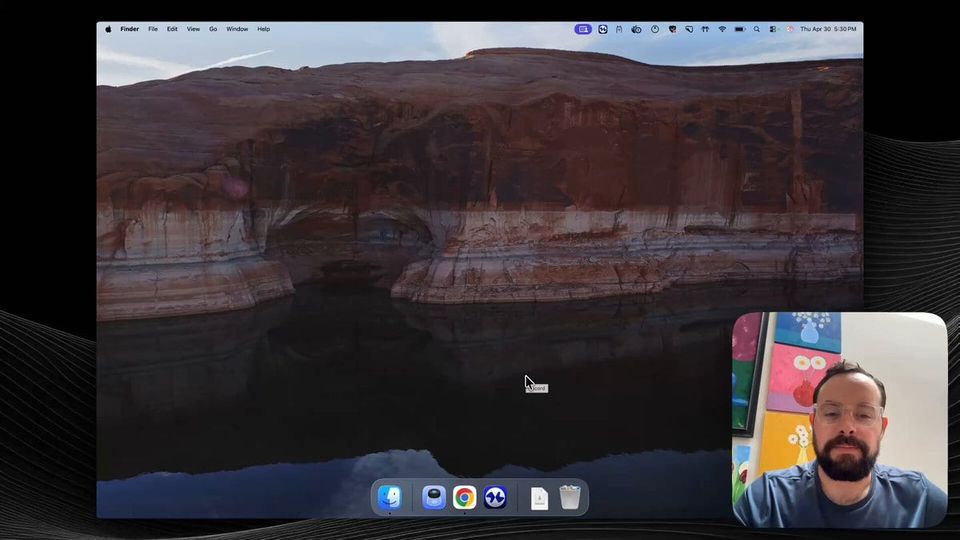 Sam on webcam in the corner of a screen recording of a Mac desktop with a canyon lake wallpaper