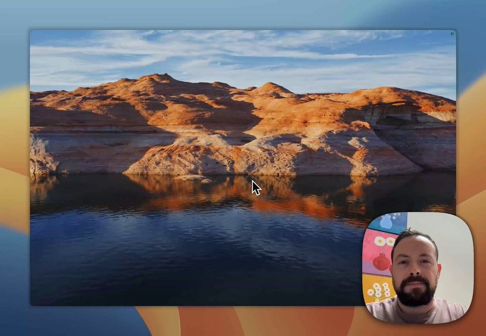 Sam in a pink shirt on webcam over a screen recording of a desktop with a canyon lake wallpaper