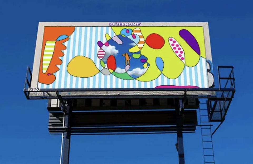Billboard of colorful abstract blobs and stripes against a blue sky