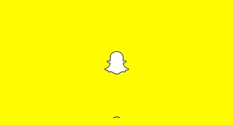 Snapchat homepage showing only the white ghost logo on a bright yellow background