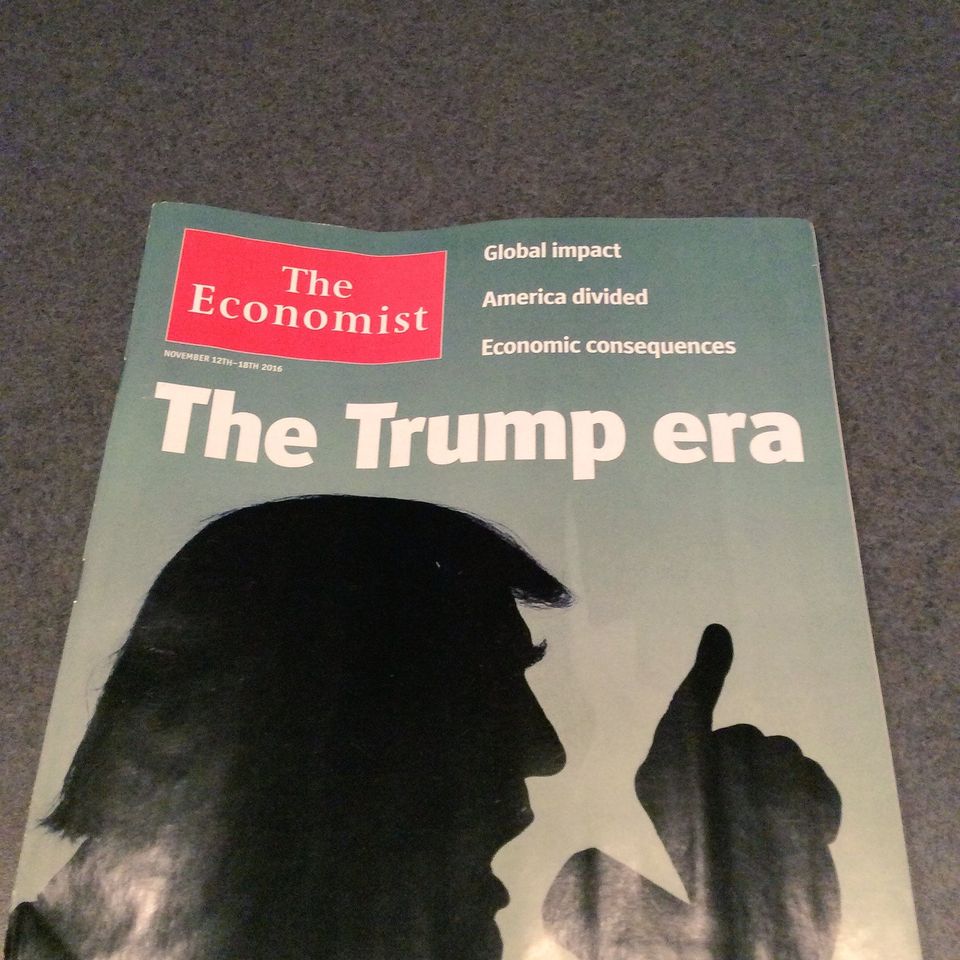 The Economist cover for November 12, 2016 reading The Trump era over a silhouette of Trump raising a finger