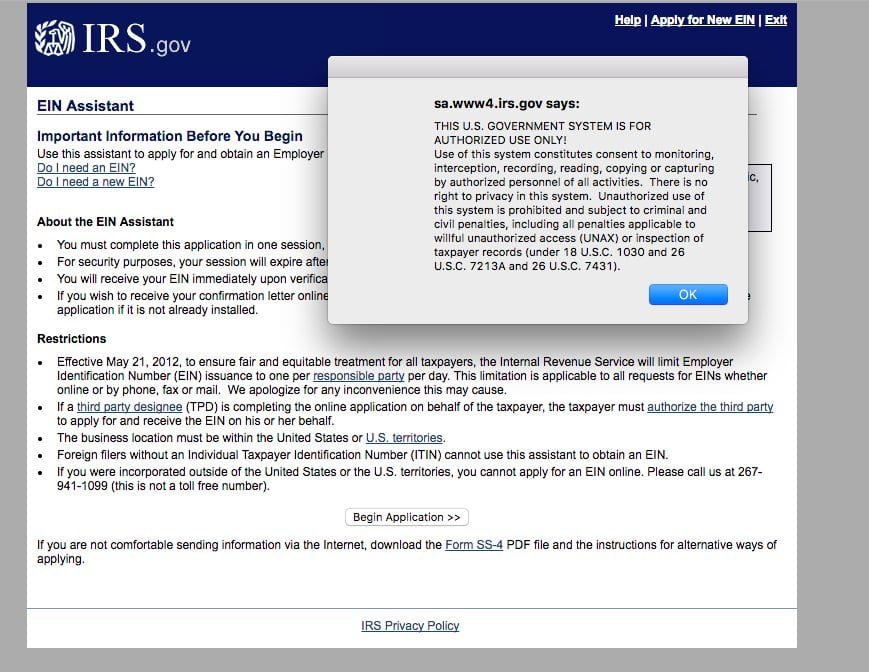 IRS EIN Assistant page with a pop-up warning this government system is for authorized use only