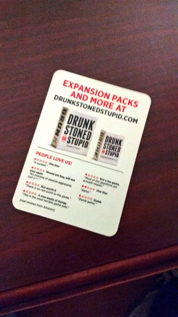 Drunk Stoned or Stupid card under People Love Us! listing one-star Amazon reviews like It sucked and Dumb game