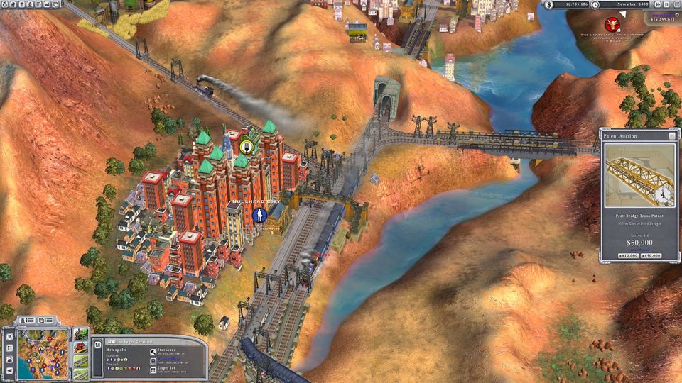 Sid Meier's Railroads game with rail lines, a bridge and Bullhead City beside a river canyon plus a patent auction panel