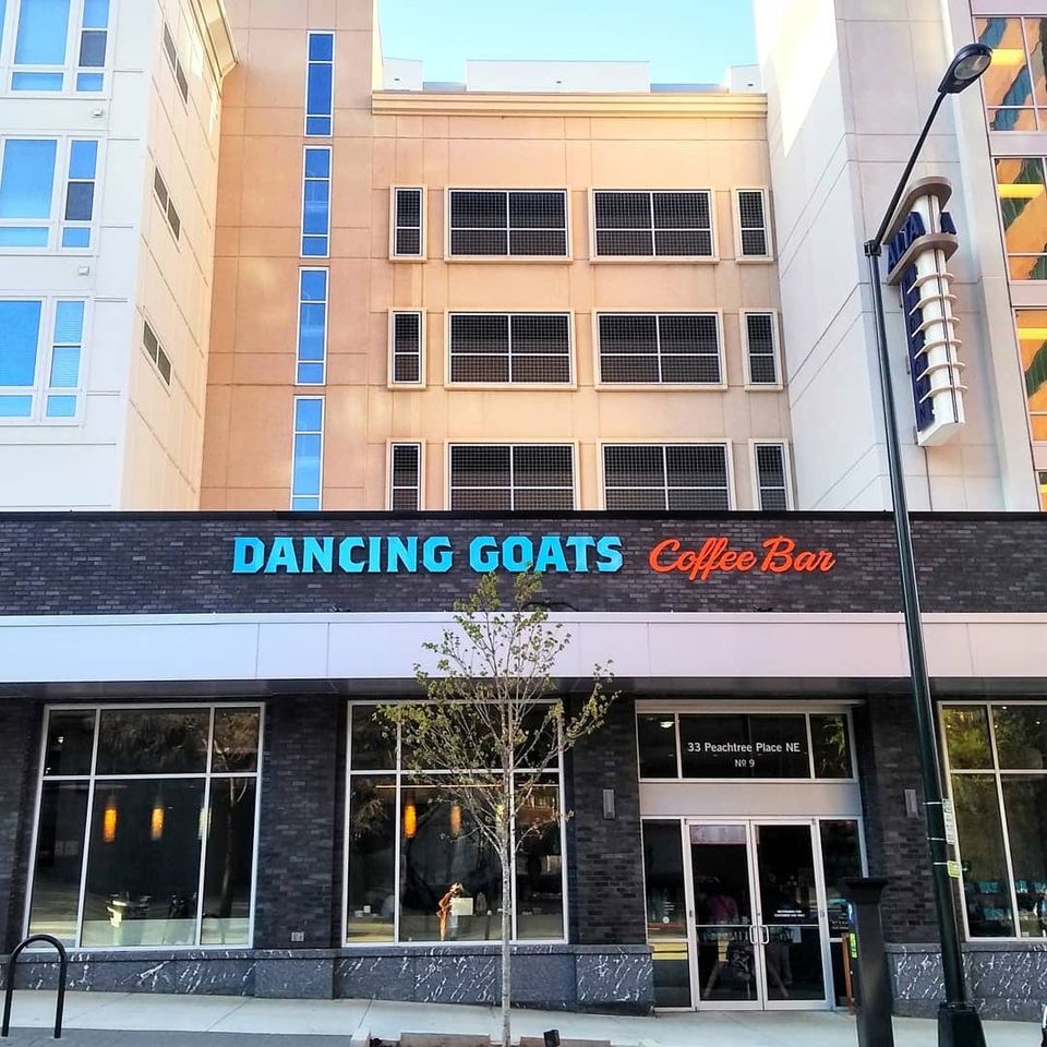 Dancing Goats Coffee Bar storefront at 33 Peachtree Place NE below a tan building