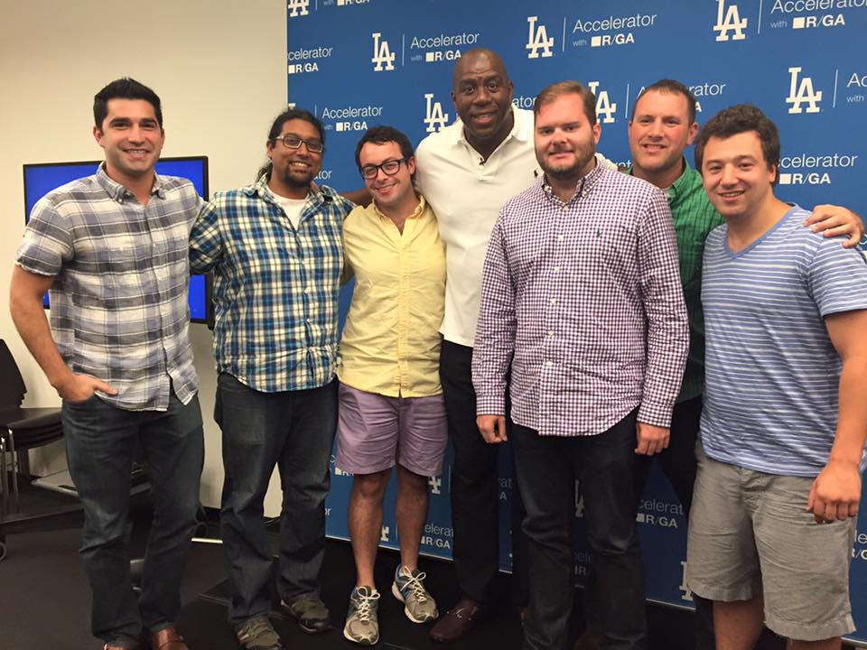 Group of seven men posing in front of an LA Dodgers Accelerator with R/GA backdrop