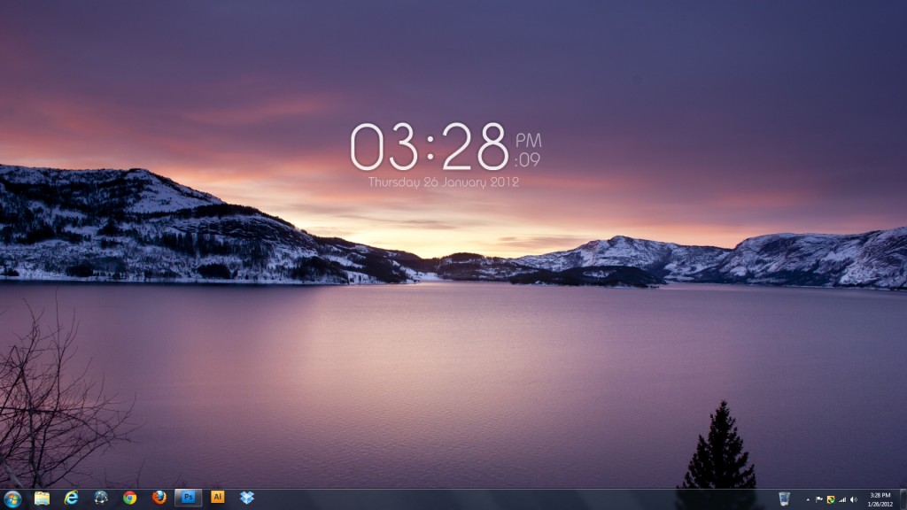 Windows desktop screenshot showing a purple-toned fjord landscape wallpaper with snowy mountains, displaying the time 03:28 PM on Thursday 26 January 2012