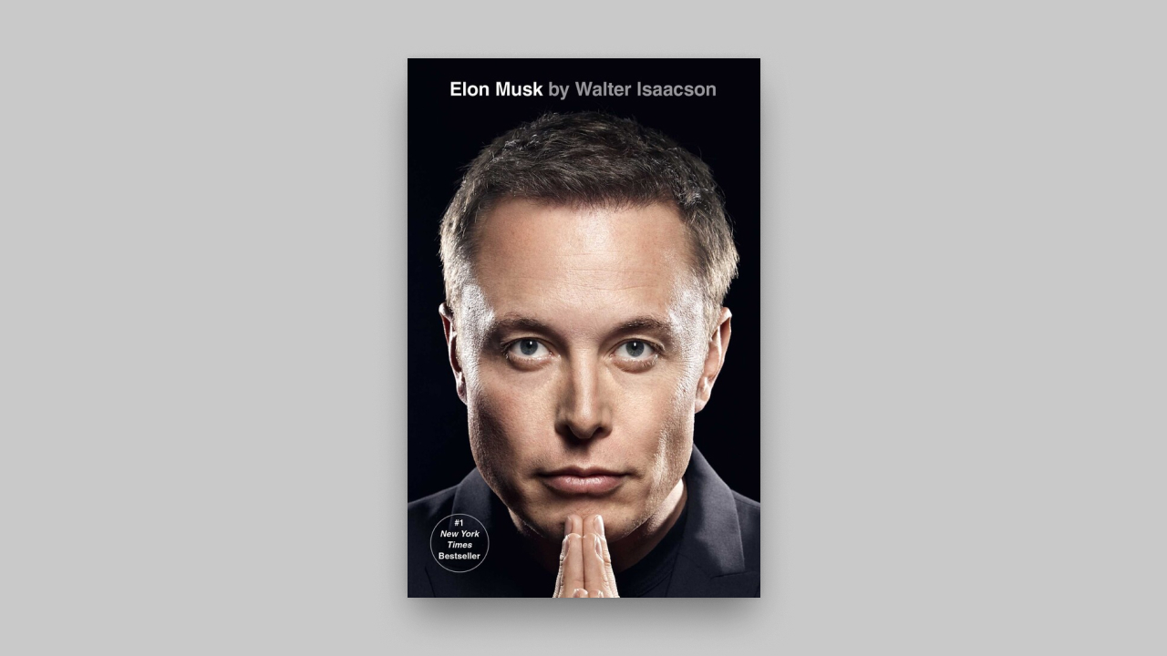 Book cover of "Elon Musk by Walter Isaacson," a #1 New York Times Bestseller, featuring a close-up portrait of a man with hands clasped under his chin