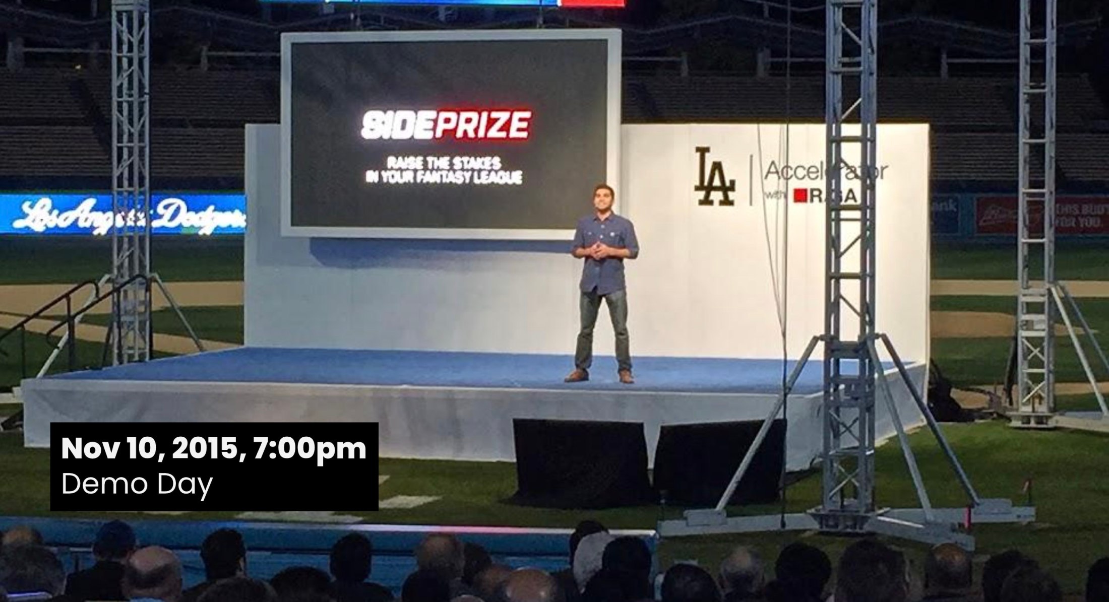 A man presents SidePrize on stage at Dodger Stadium during the LA Accelerator Demo Day, Nov 10, 2015